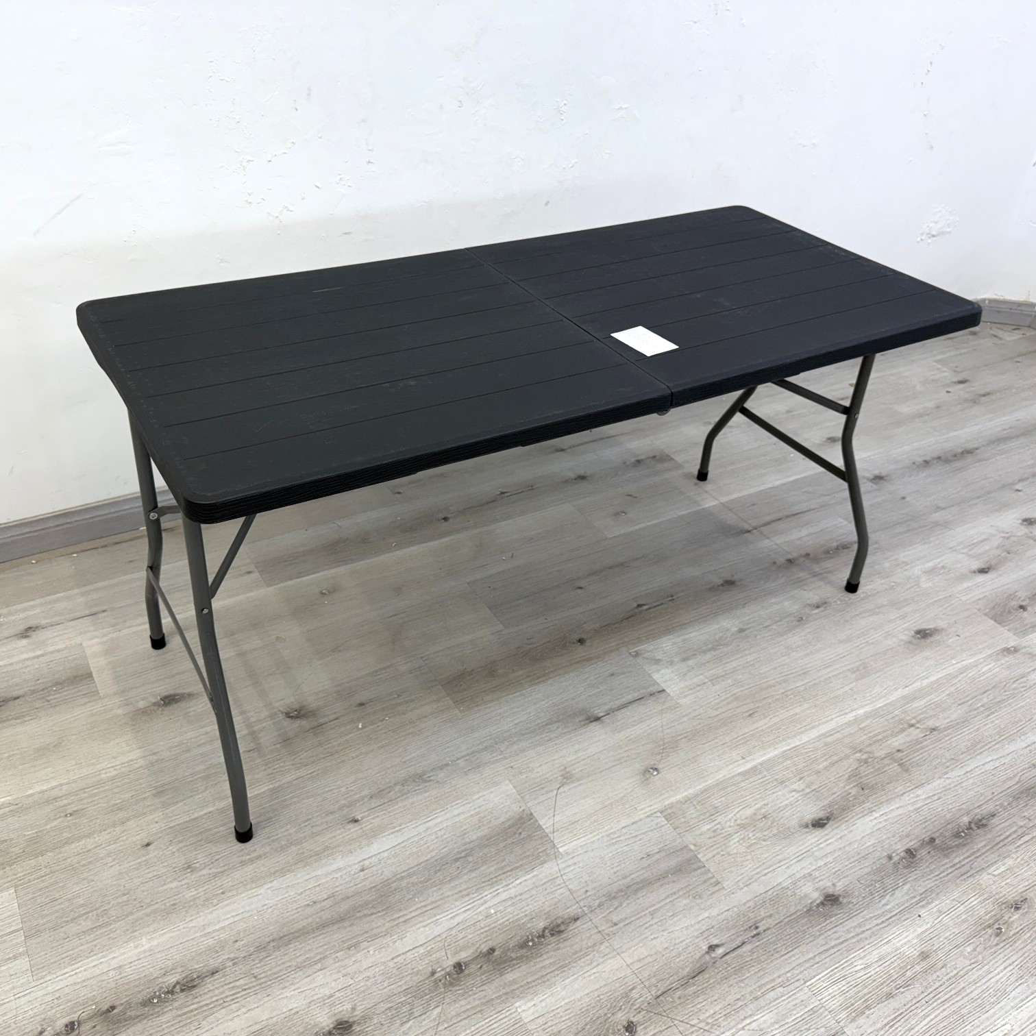 Ridge 1.5m black outdoor folding table with stone-finish plastic top and metal legs