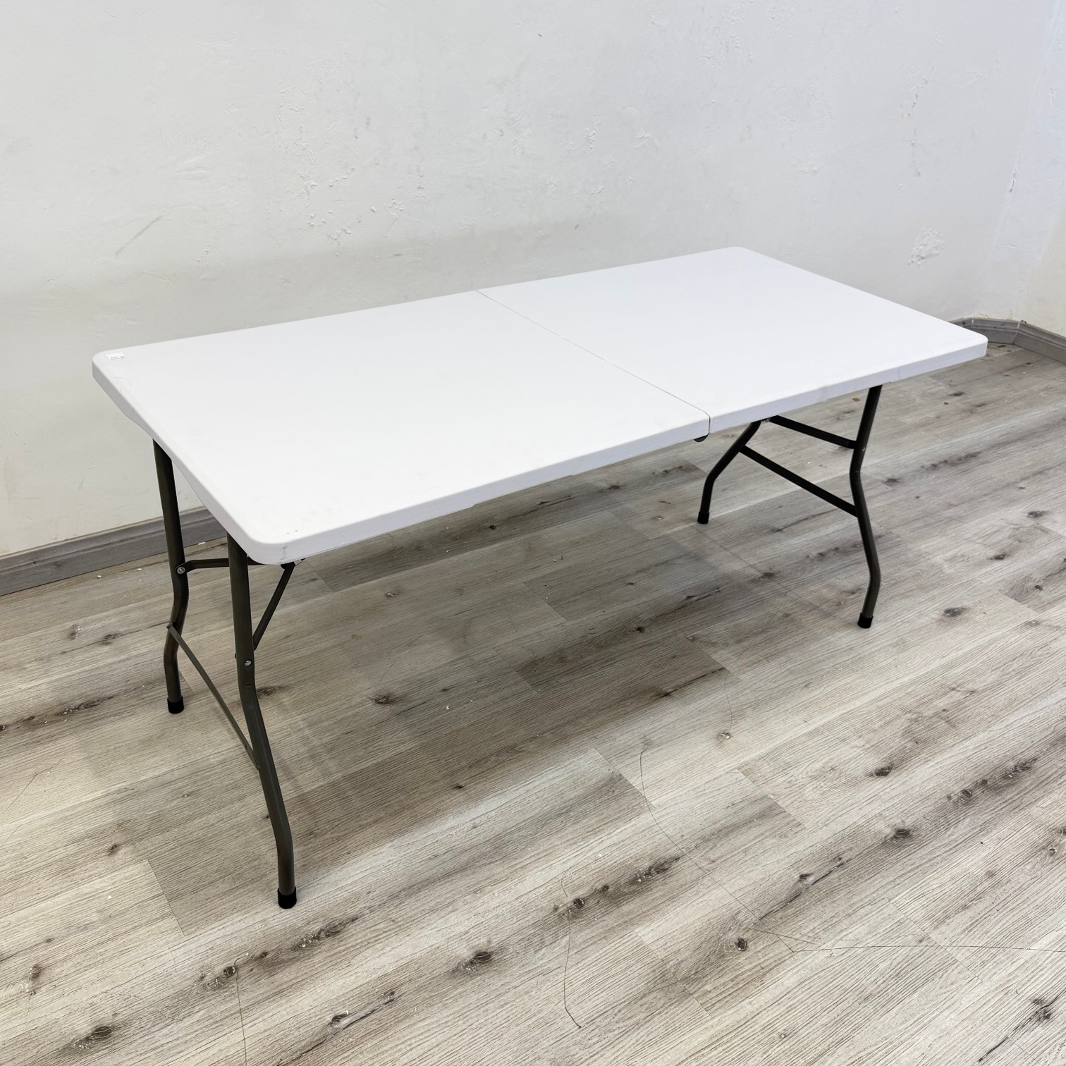 Parker 1.5m white outdoor folding table with plastic top and metal folding legs